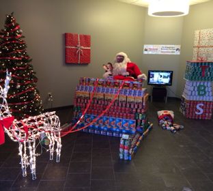 Food in the form of Santa's sleigh was donated by TBS employees as part of the annual CANstruction project that donated food to local pantrys.